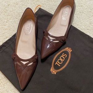 Beautiful Tod’s brown patent leather slip-ons.